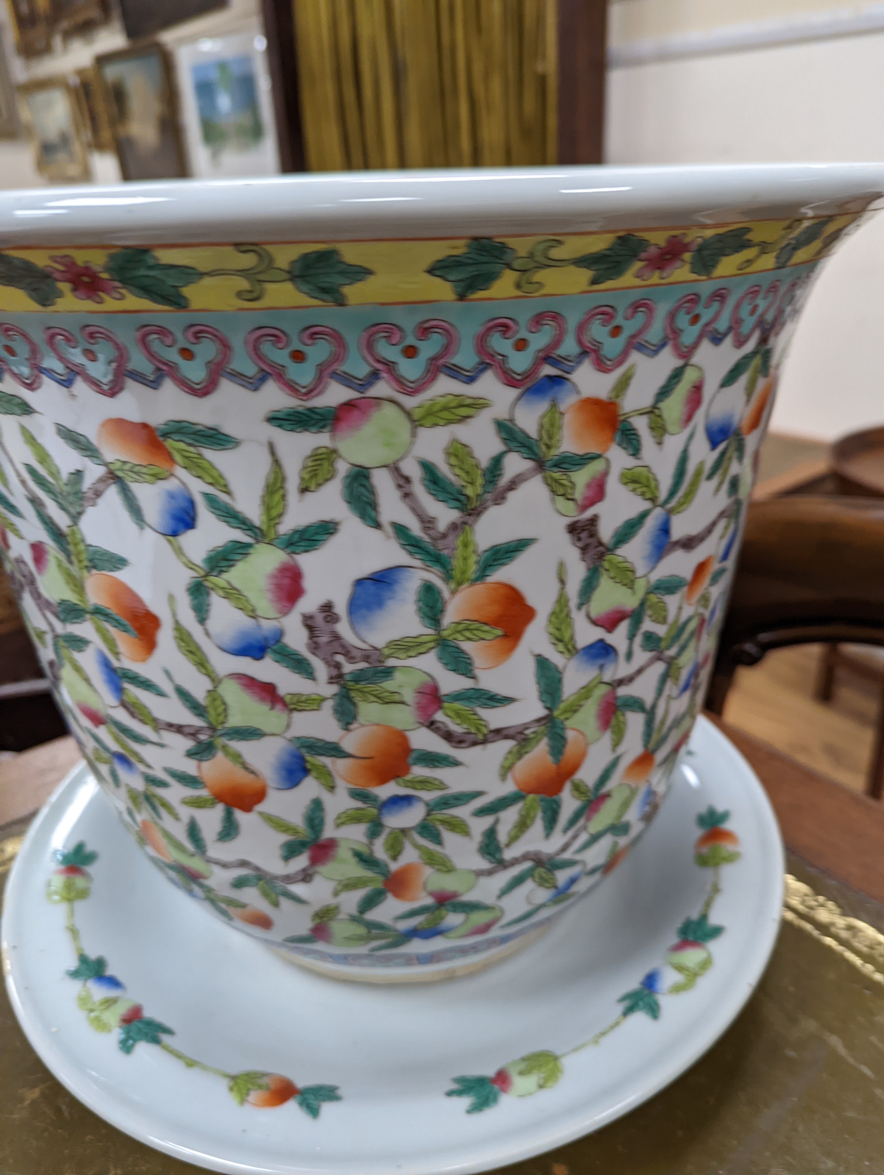 A 20th century Chinese porcelain jardiniere and dish, diameter 36 cms.